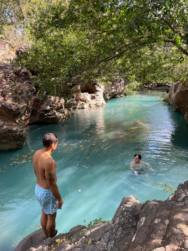 Visitors swimming in the turquoise Los Coyotes pools